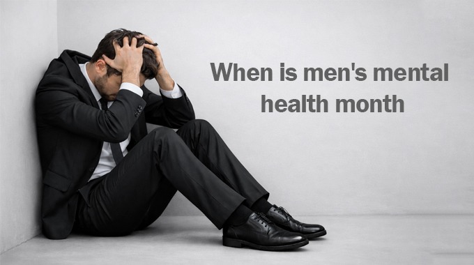 Stressed businessman sitting on the floor holding his head next to text about Men’s Mental Health Month awareness.